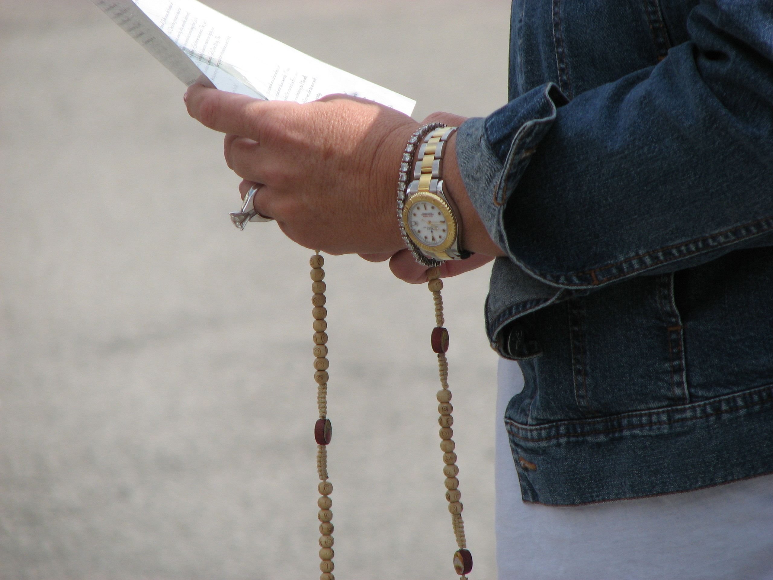 Woman Praying the Rosary