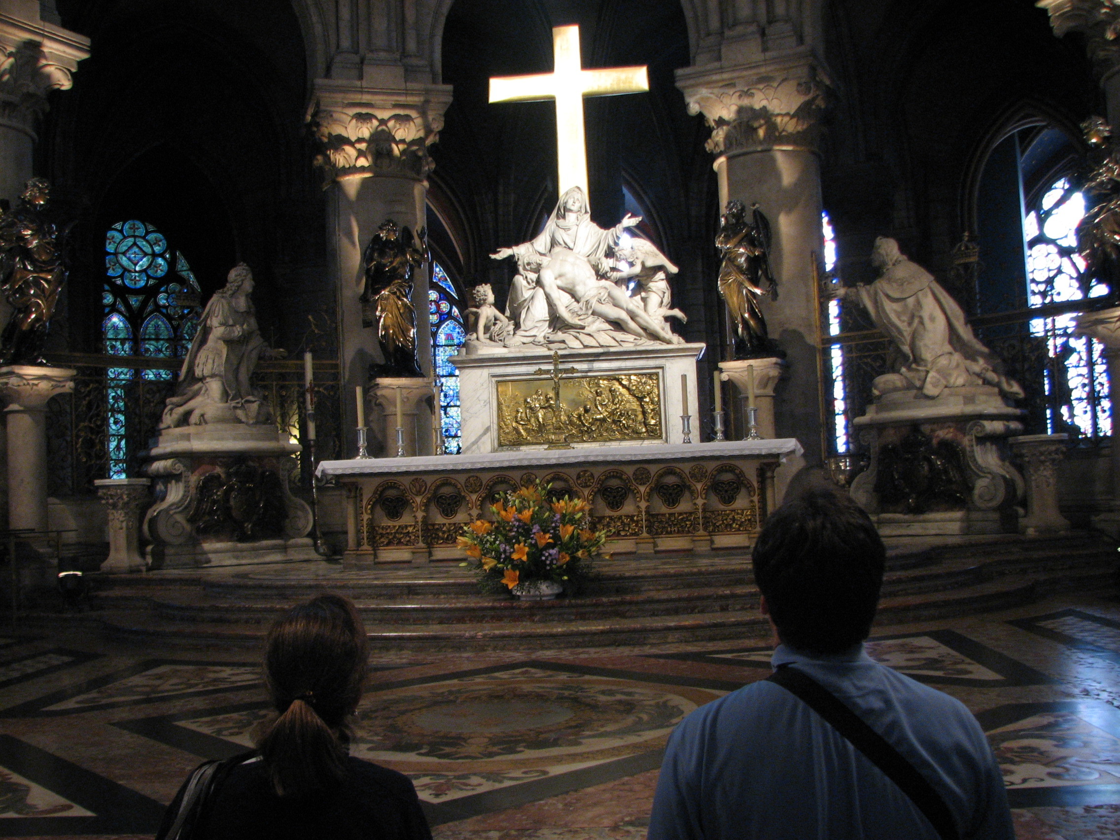 photo of altar with statue of Mary under cross