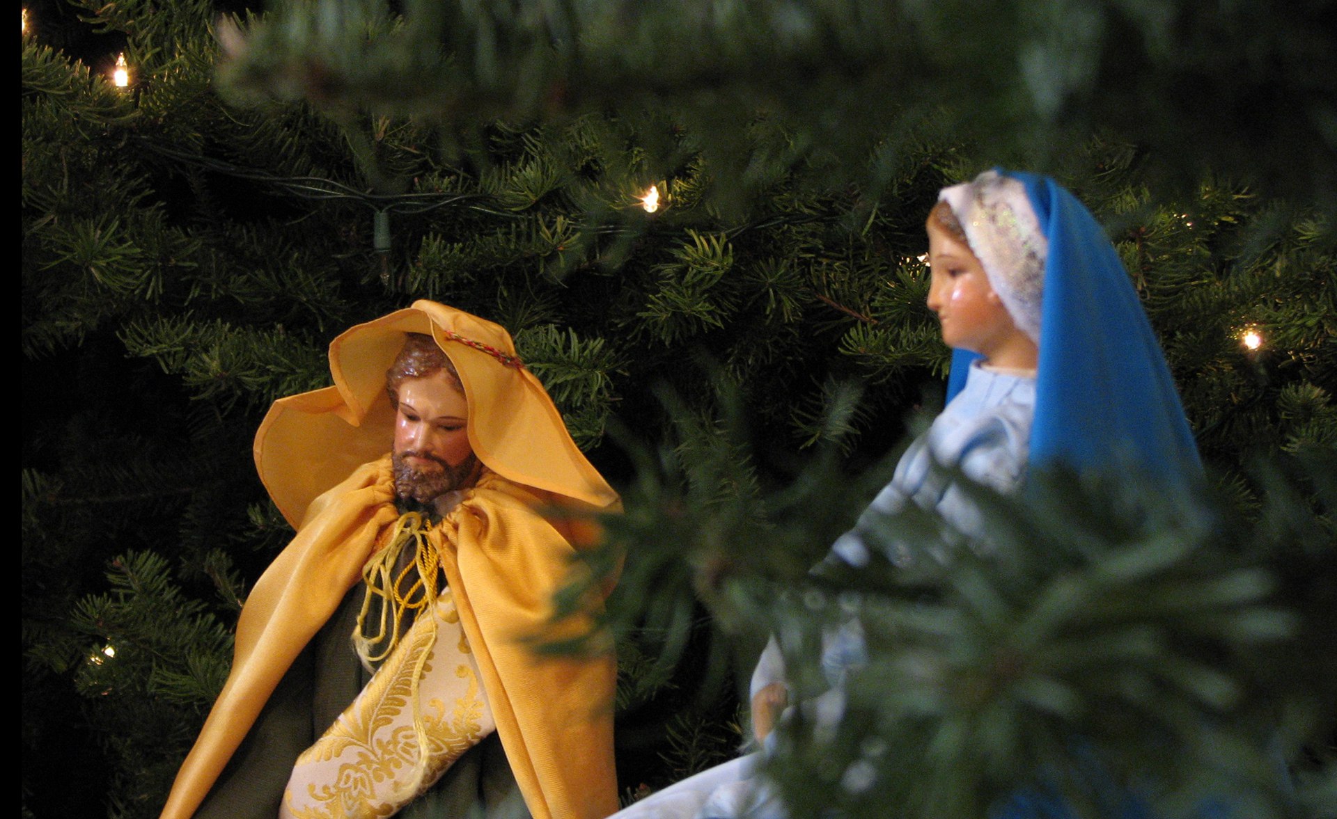 St. Joseph and Mary figurines in a Christmas tree