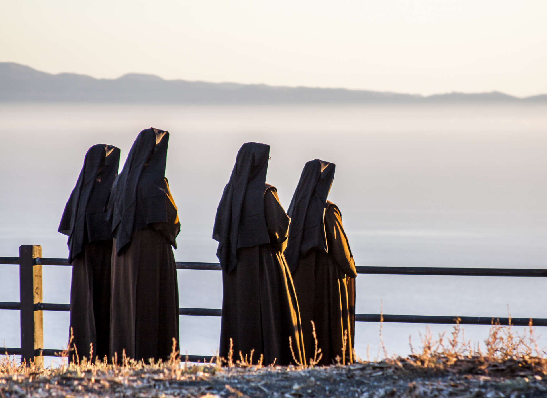 group of sisters looking out towards ocean